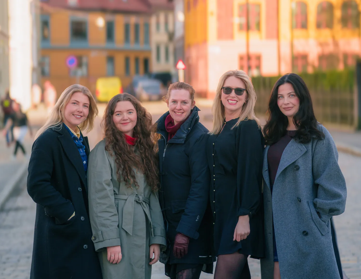 Five Kravia colleagues standing together on a street in Oslo